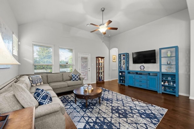 232 Mandana St, Leander, TX 78641 - living room with dark wood-type flooring, a ceiling fan, arched walkways, and high vaulted ceiling