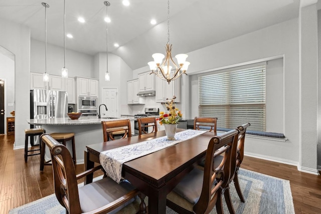 232 Mandana St, Leander, TX 78641 - dining area featuring a chandelier, lofted ceiling, dark wood-style flooring, and recessed lighting