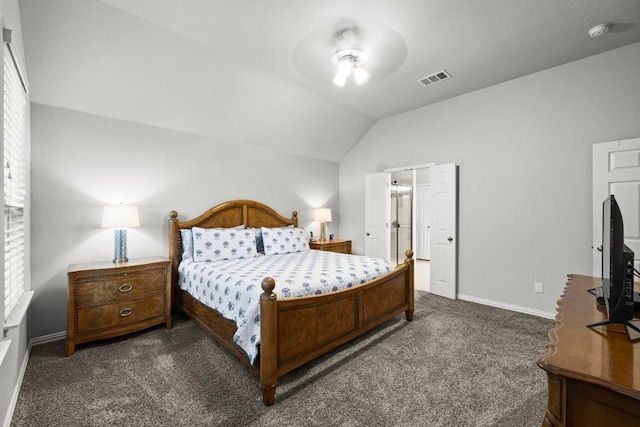 232 Mandana St, Leander, TX 78641 - bedroom with dark carpet, vaulted ceiling, and a ceiling fan