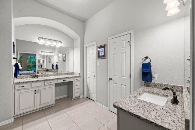 232 Mandana St, Leander, TX 78641 - bathroom with vanity, tile patterned floors, and ensuite bath