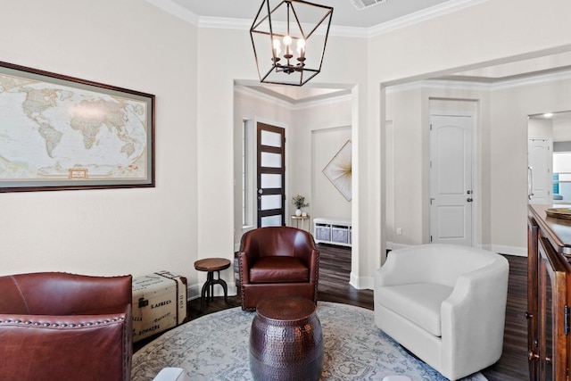 1329 Siena Sunset Rd, Leander, TX 78641 - sitting room featuring a chandelier, wood finished floors, and crown molding