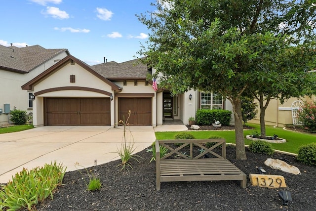 1329 Siena Sunset Rd, Leander, TX 78641 - view of front of home with a garage, driveway, stucco siding, and a front lawn