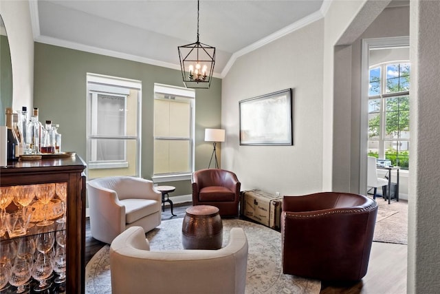 1329 Siena Sunset Rd, Leander, TX 78641 - sitting room featuring wood finished floors, ornamental molding, and a chandelier
