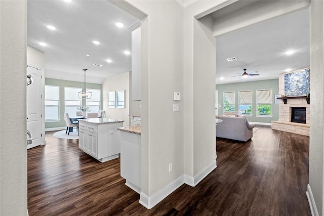 1329 Siena Sunset Rd, Leander, TX 78641 - hallway with dark wood finished floors and recessed lighting