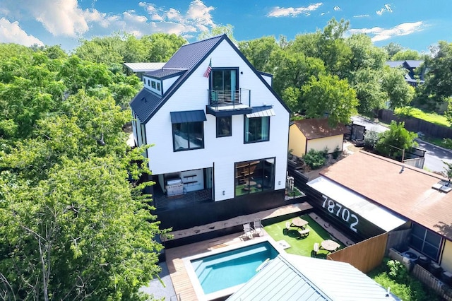 1914 E 8th St, Austin, TX 78702 - back of property with a balcony and a metal roof