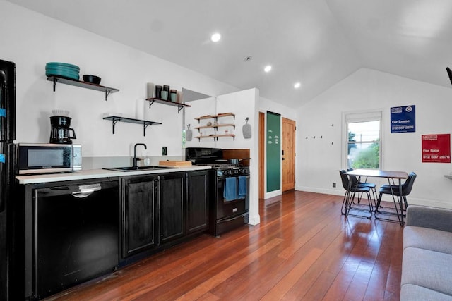 1914 E 8th St, Austin, TX 78702 - kitchen featuring black appliances, open shelves, dark cabinets, vaulted ceiling, and dark wood-style flooring