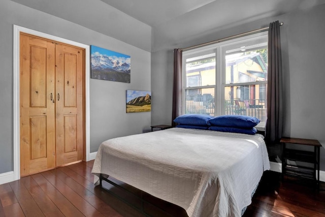 1914 E 8th St, Austin, TX 78702 - bedroom featuring dark wood-style flooring and lofted ceiling