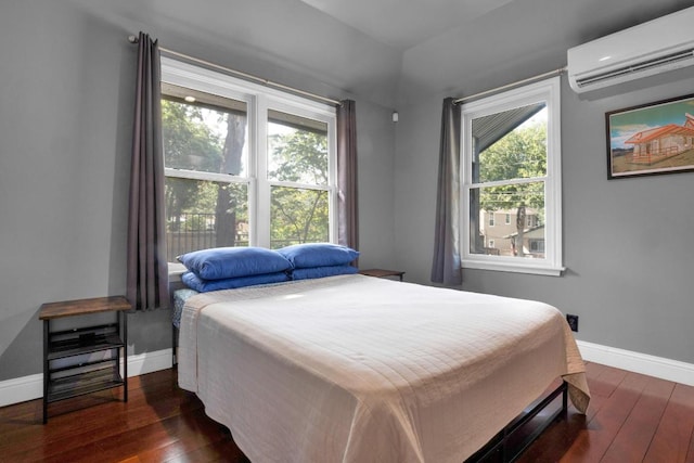 1914 E 8th St, Austin, TX 78702 - bedroom with a wall unit AC, hardwood / wood-style flooring, and multiple windows