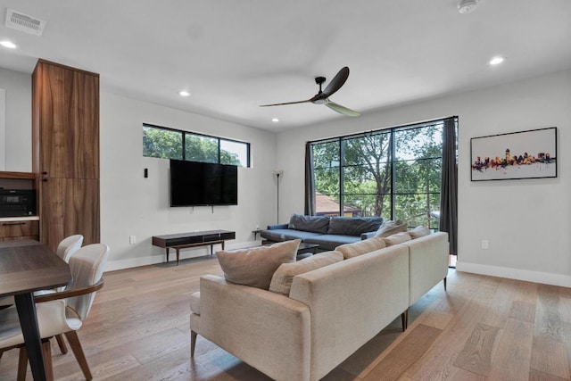 1914 E 8th St, Austin, TX 78702 - living room with recessed lighting, light wood-style floors, and ceiling fan