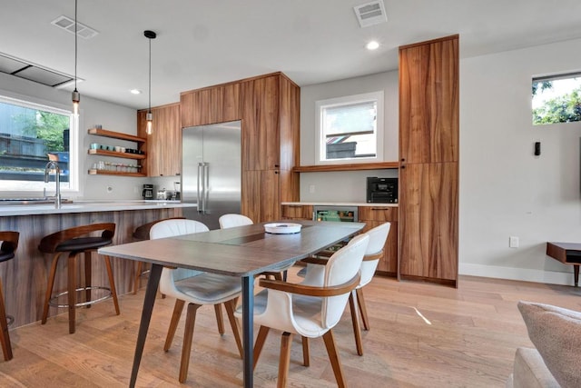 1914 E 8th St, Austin, TX 78702 - dining room with light wood-type flooring and recessed lighting