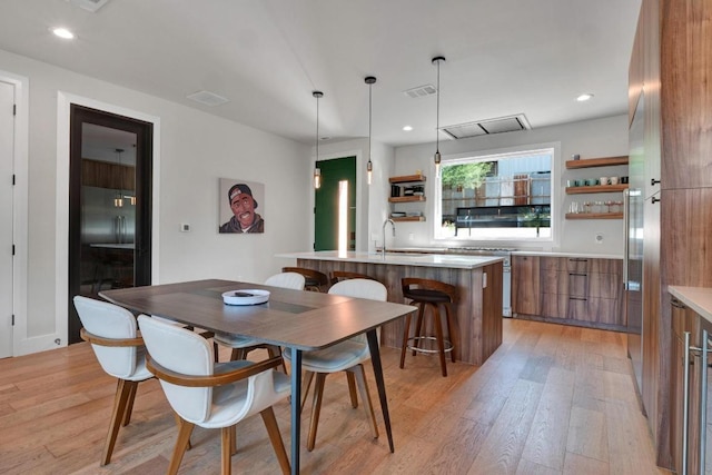 1914 E 8th St, Austin, TX 78702 - dining area with light wood-style flooring and recessed lighting