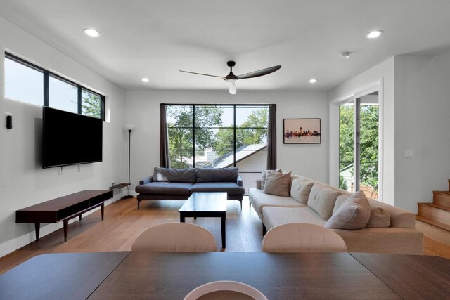 1914 E 8th St, Austin, TX 78702 - living area featuring healthy amount of natural light, recessed lighting, a ceiling fan, light wood-style floors, and stairs
