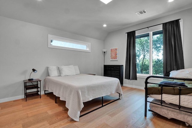 1914 E 8th St, Austin, TX 78702 - bedroom featuring multiple windows, light wood-style floors, recessed lighting, and vaulted ceiling