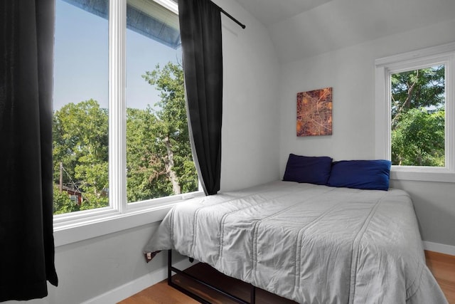 1914 E 8th St, Austin, TX 78702 - bedroom featuring lofted ceiling and wood finished floors