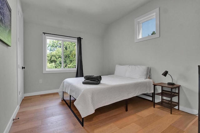 1914 E 8th St, Austin, TX 78702 - bedroom with light wood-style floors and baseboards