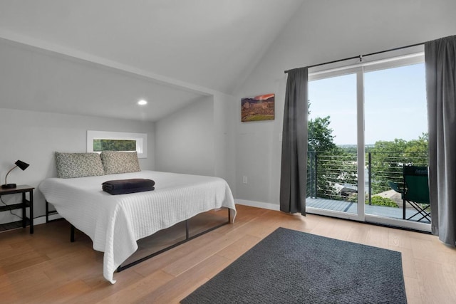1914 E 8th St, Austin, TX 78702 - bedroom featuring multiple windows, wood finished floors, high vaulted ceiling, recessed lighting, and access to outside