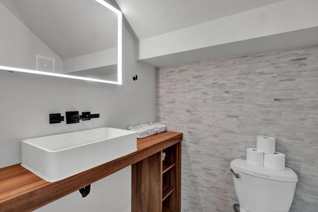 1914 E 8th St, Austin, TX 78702 - bathroom with toilet and vaulted ceiling