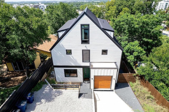 1914 E 8th St, Austin, TX 78702 - rear view of house with view of wooded area