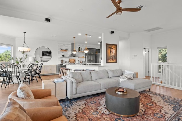18113 Travis Dr, Lago Vista, TX 78645 - living area featuring ornamental molding, light wood finished floors, and a ceiling fan