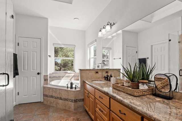 18113 Travis Dr, Lago Vista, TX 78645 - full bath featuring a garden tub, double vanity, and a shower stall