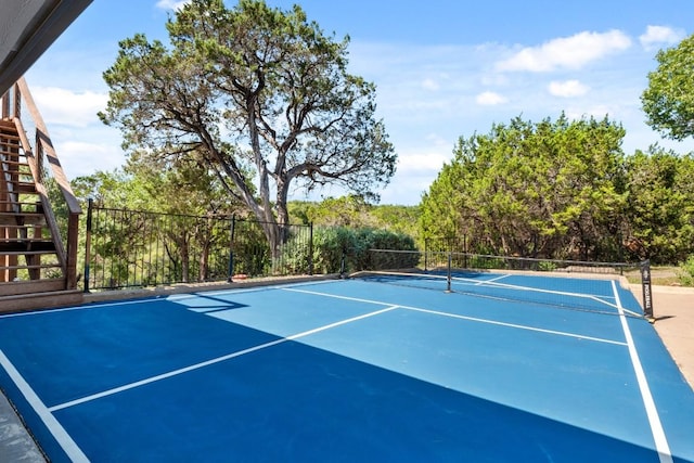 18113 Travis Dr, Lago Vista, TX 78645 - view of tennis court featuring stairs and basketball court