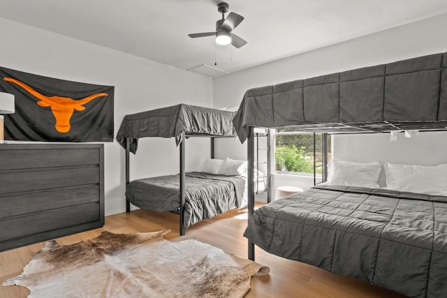 18113 Travis Dr, Lago Vista, TX 78645 - bedroom featuring wood finished floors and ceiling fan