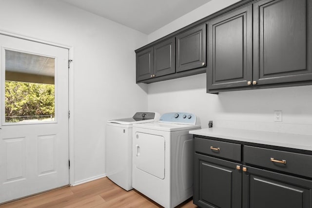 18113 Travis Dr, Lago Vista, TX 78645 - washroom with cabinet space, washer and clothes dryer, and light wood-type flooring