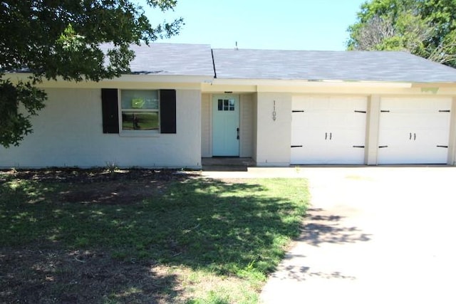 1109 W Lincoln Ave, Copperas Cove, TX 76522 - ranch-style house with an attached garage, concrete driveway, and stucco siding