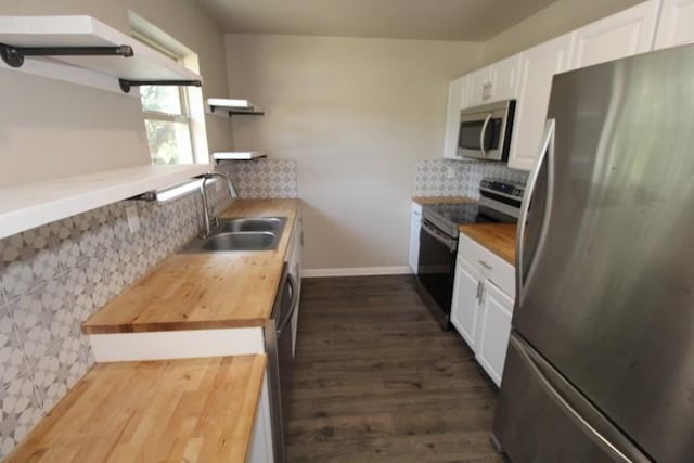 1109 W Lincoln Ave, Copperas Cove, TX 76522 - kitchen featuring stainless steel appliances, butcher block countertops, open shelves, decorative backsplash, and dark wood finished floors