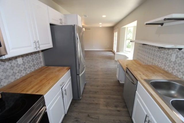 1109 W Lincoln Ave, Copperas Cove, TX 76522 - kitchen featuring wooden counters, appliances with stainless steel finishes, open shelves, white cabinets, and recessed lighting