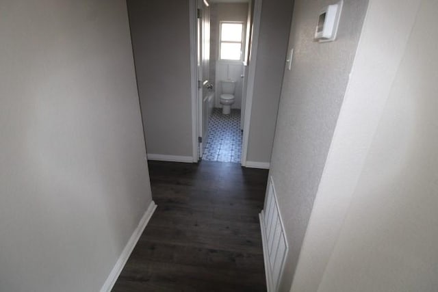 1109 W Lincoln Ave, Copperas Cove, TX 76522 - hallway with dark wood finished floors and baseboards