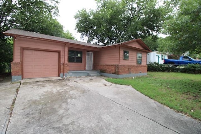 313 Elm St, Copperas Cove, TX 76522 - ranch-style home with driveway, a garage, a front lawn, and brick siding