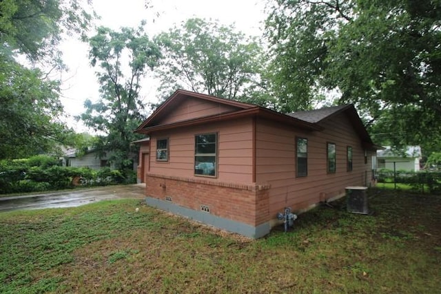 313 Elm St, Copperas Cove, TX 76522 - view of home's exterior with a yard and brick siding