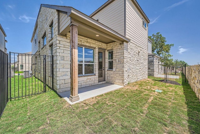 1531 N Red Bud Ln Unit 33, Round Rock, TX 78665 - view of home's exterior featuring stone siding and a fenced backyard