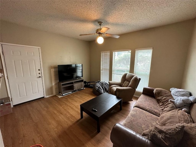 2414 Longview St Unit 301, Austin, TX 78705 - living room with a ceiling fan, wood finished floors, and a textured ceiling