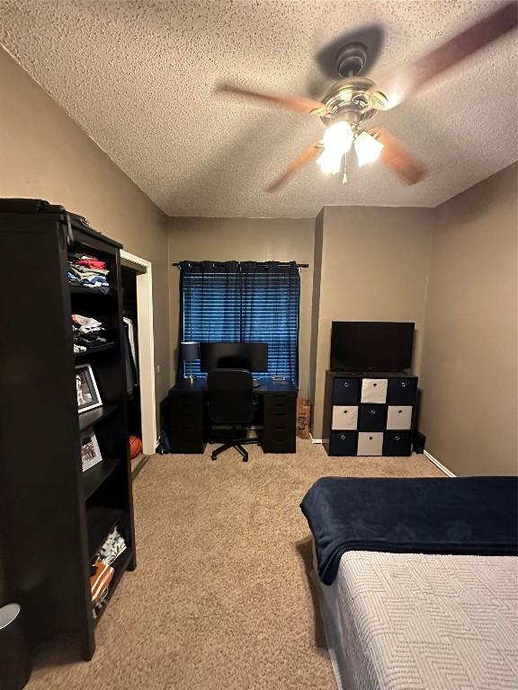 2414 Longview St Unit 301, Austin, TX 78705 - carpeted bedroom with a textured ceiling, a desk, and ceiling fan
