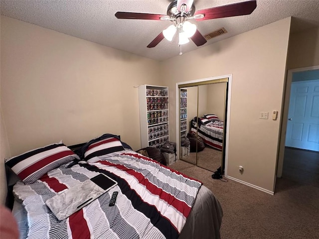 2414 Longview St Unit 301, Austin, TX 78705 - carpeted bedroom featuring a closet, a textured ceiling, and a ceiling fan
