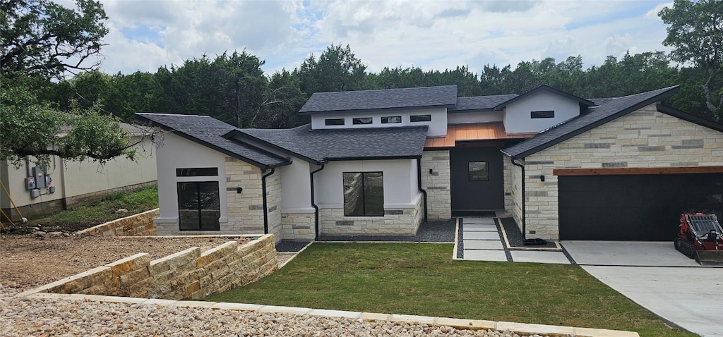 4400 Lindberg Ln, Lago Vista, TX 78645 - view of front of house featuring stone siding, a garage, concrete driveway, roof with shingles, and stucco siding