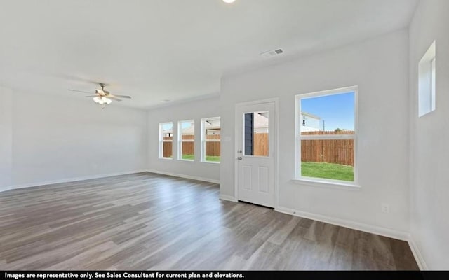 290 Yosemite Dr, Kyle, TX 78640 - unfurnished room with wood finished floors and a ceiling fan