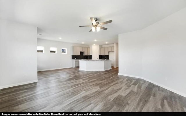 290 Yosemite Dr, Kyle, TX 78640 - unfurnished living room featuring ceiling fan, wood finished floors, and recessed lighting