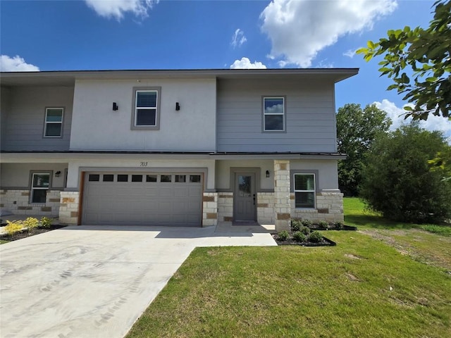 2105 Tiger Trl Unit 703, Round Rock, TX 78664 - view of front of property with stone siding, a front lawn, a garage, and concrete driveway
