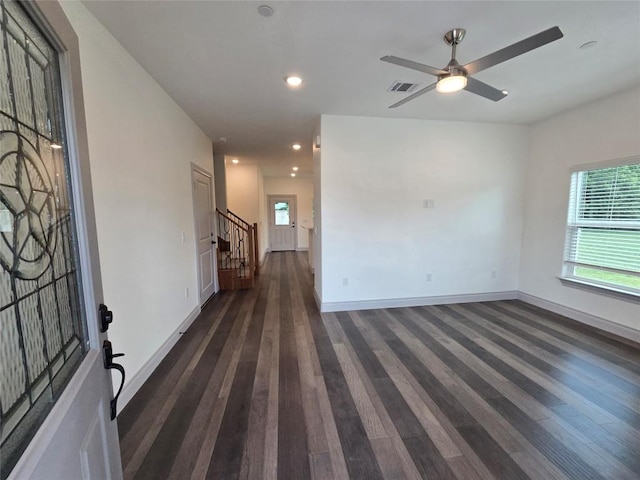 2105 Tiger Trl Unit 703, Round Rock, TX 78664 - unfurnished room featuring dark wood-type flooring, stairs, ceiling fan, and recessed lighting