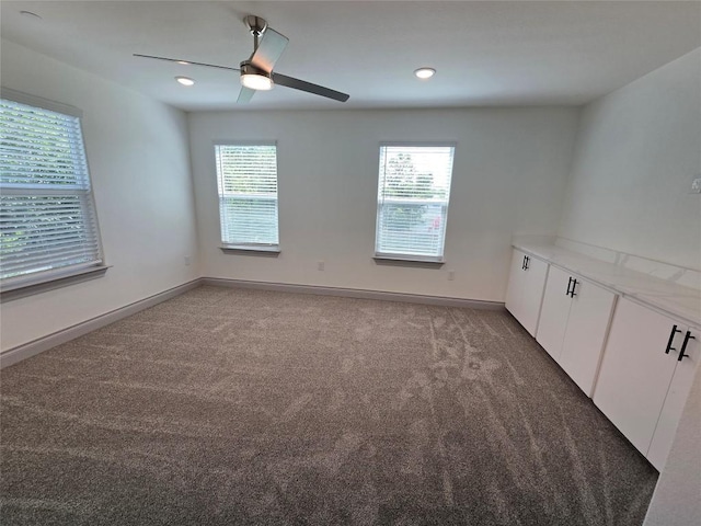 2105 Tiger Trl Unit 703, Round Rock, TX 78664 - empty room with light carpet, plenty of natural light, ceiling fan, and recessed lighting