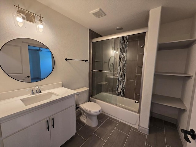 2105 Tiger Trl Unit 703, Round Rock, TX 78664 - full bath featuring vanity, shower / bath combination with glass door, and a textured ceiling