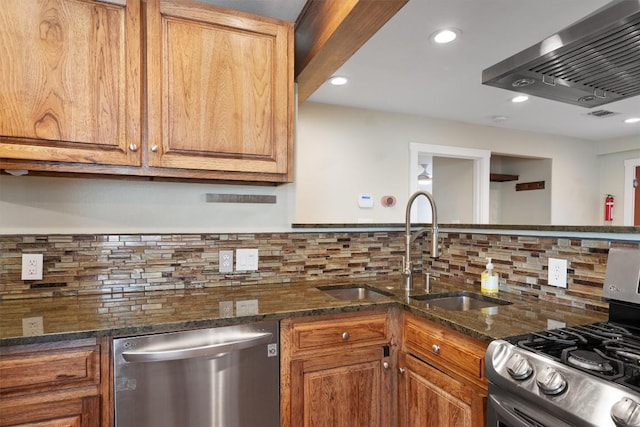 6202 Hillston Dr, Austin, TX 78745 - kitchen with stainless steel appliances, wall chimney range hood, tasteful backsplash, recessed lighting, and dark stone countertops