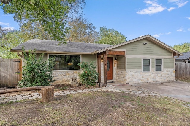 6202 Hillston Dr, Austin, TX 78745 - view of front of house featuring stone siding and a shingled roof