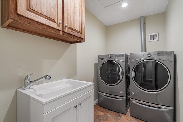 6202 Hillston Dr, Austin, TX 78745 - washroom with cabinet space, washing machine and dryer, and stone finish floors