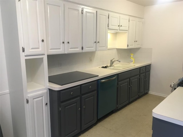 4907 Hawk Cv, Austin, TX 78745 - kitchen featuring dishwashing machine, white cabinetry, tasteful backsplash, light floors, and light countertops