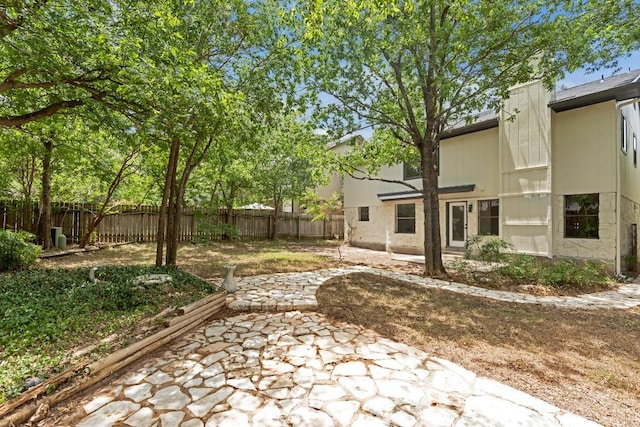 13265 Kerrville Folkway Dr, Austin, TX 78729 - fenced backyard with a patio