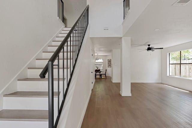 13265 Kerrville Folkway Dr, Austin, TX 78729 - staircase featuring wood finished floors and ceiling fan